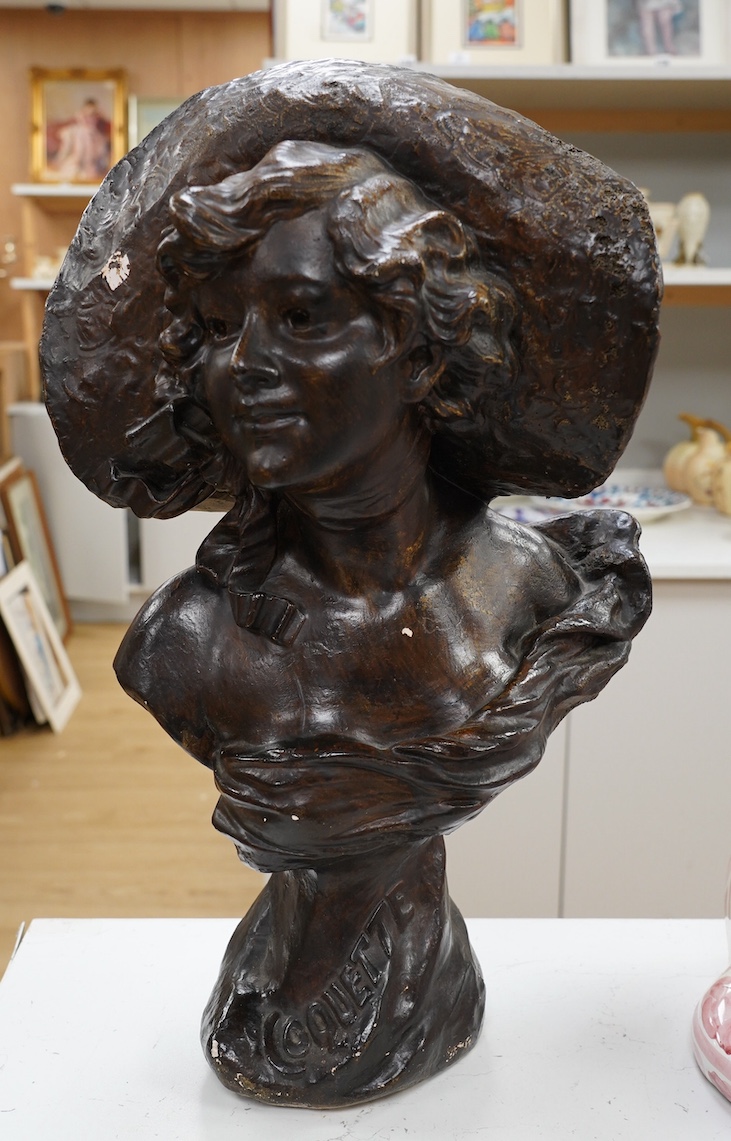 A 20th century French bronzed plaster bust of a lady ‘Coquette’, 52cm. Condition - fair, some losses to bronzing